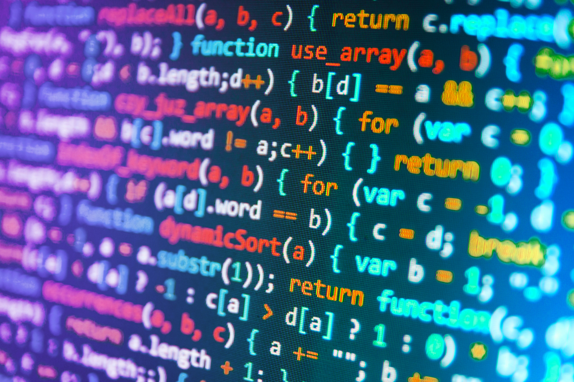 Software developer programming code on computer
